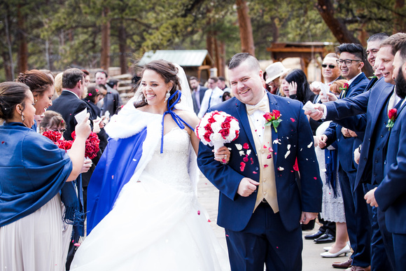 Bride and groom during petal toss and della terra wedding venue