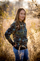 model outdoors in field wearing an autumn sweater