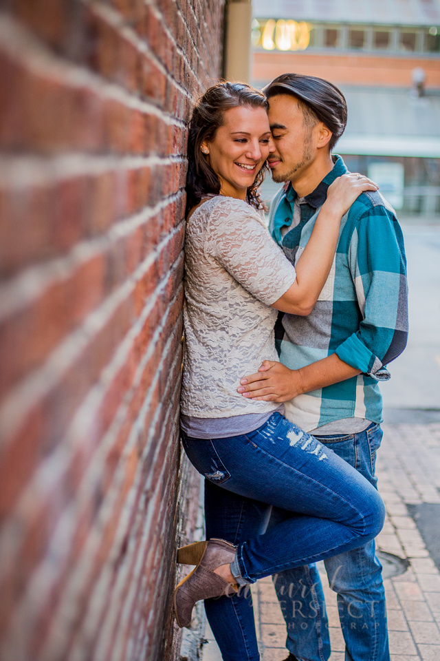 Happy couple on a bench in downtown Denver