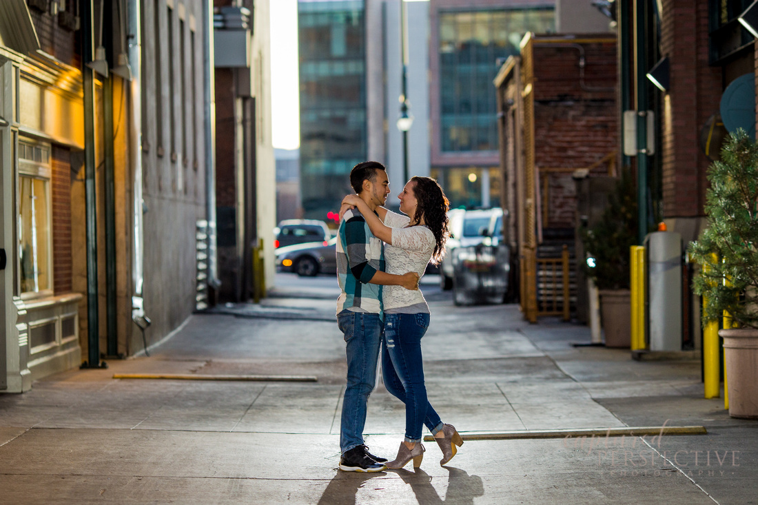 Happy couple on a bench in downtown Denver