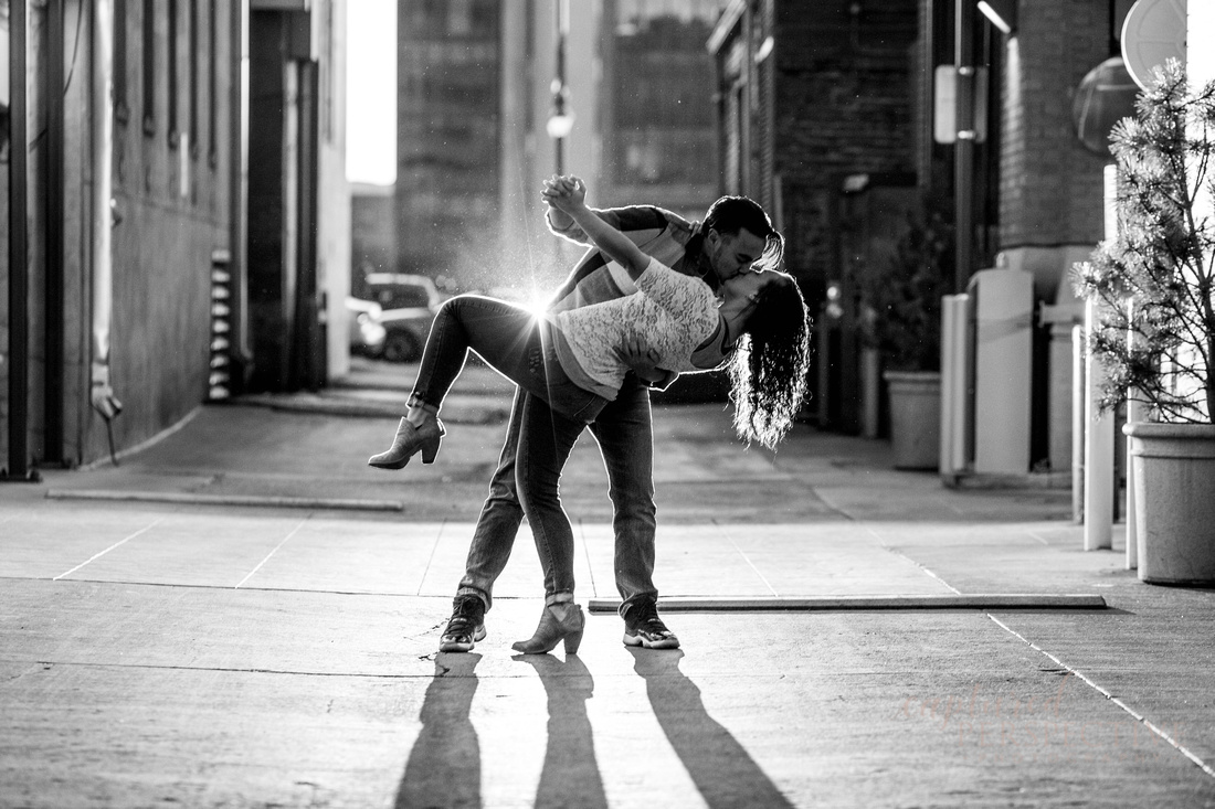 Happy couple on a bench in downtown Denver