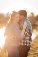 Beautiful light reflection off the lake with engaged couple