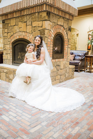 bride posing on the fire place ledge with her daughter