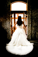 bride standing in front of doors of her honeymoon suit
