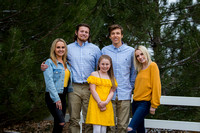 Siblings outdoor family portraits in coordinating yellow and blue outfits