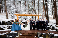 Outdoor portrait of wedding party in the snow