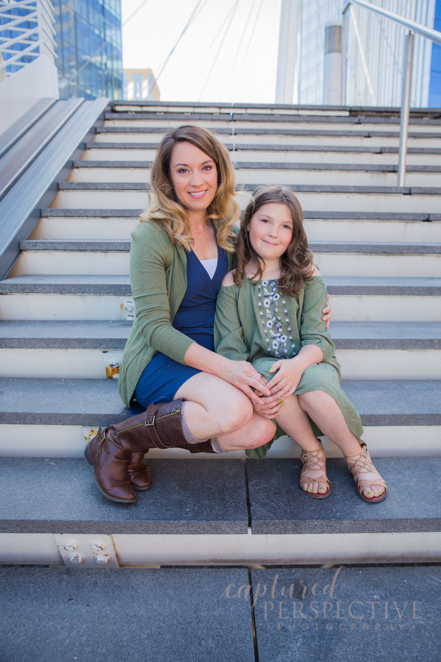 Family taking outdoor portraits in downtown Denver Colorado