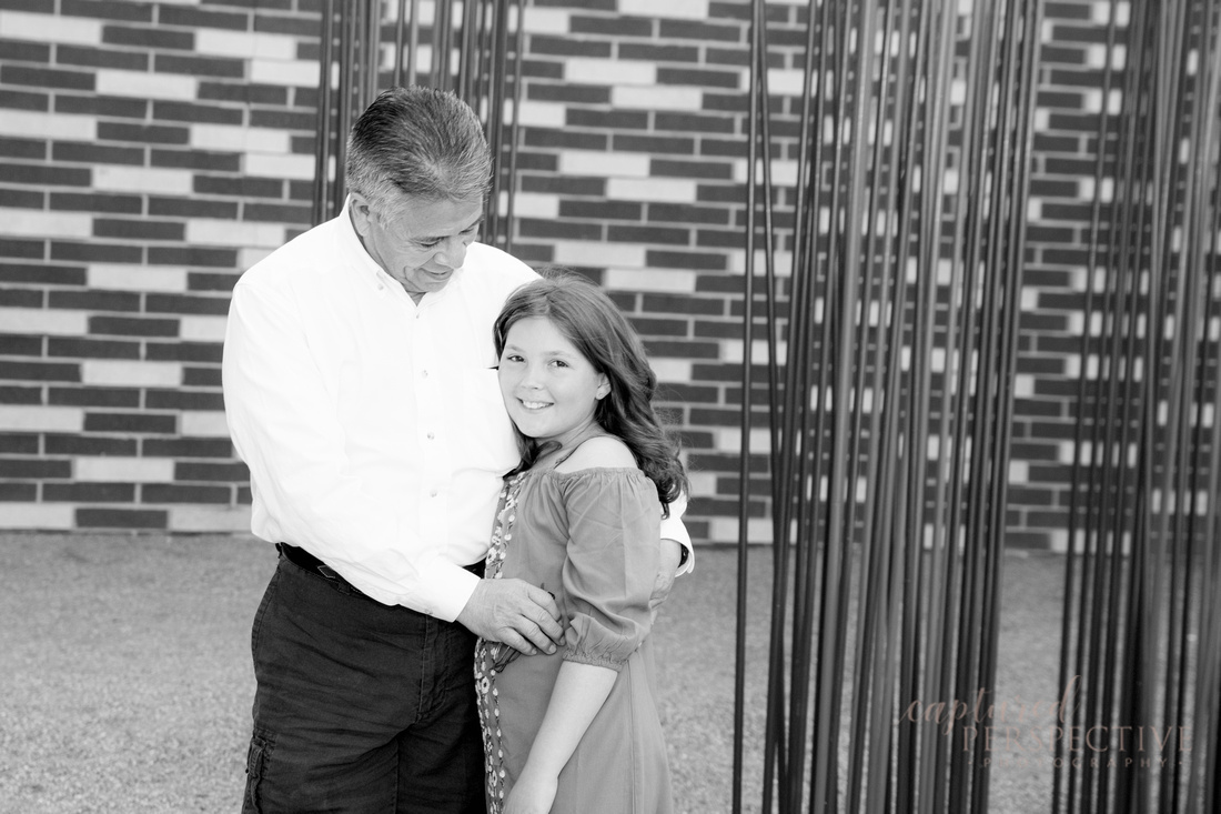 Family taking outdoor portraits in downtown Denver Colorado