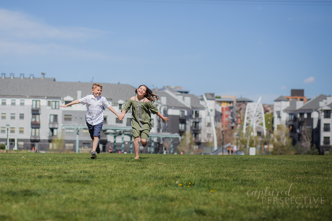 Family taking outdoor portraits in downtown Denver Colorado