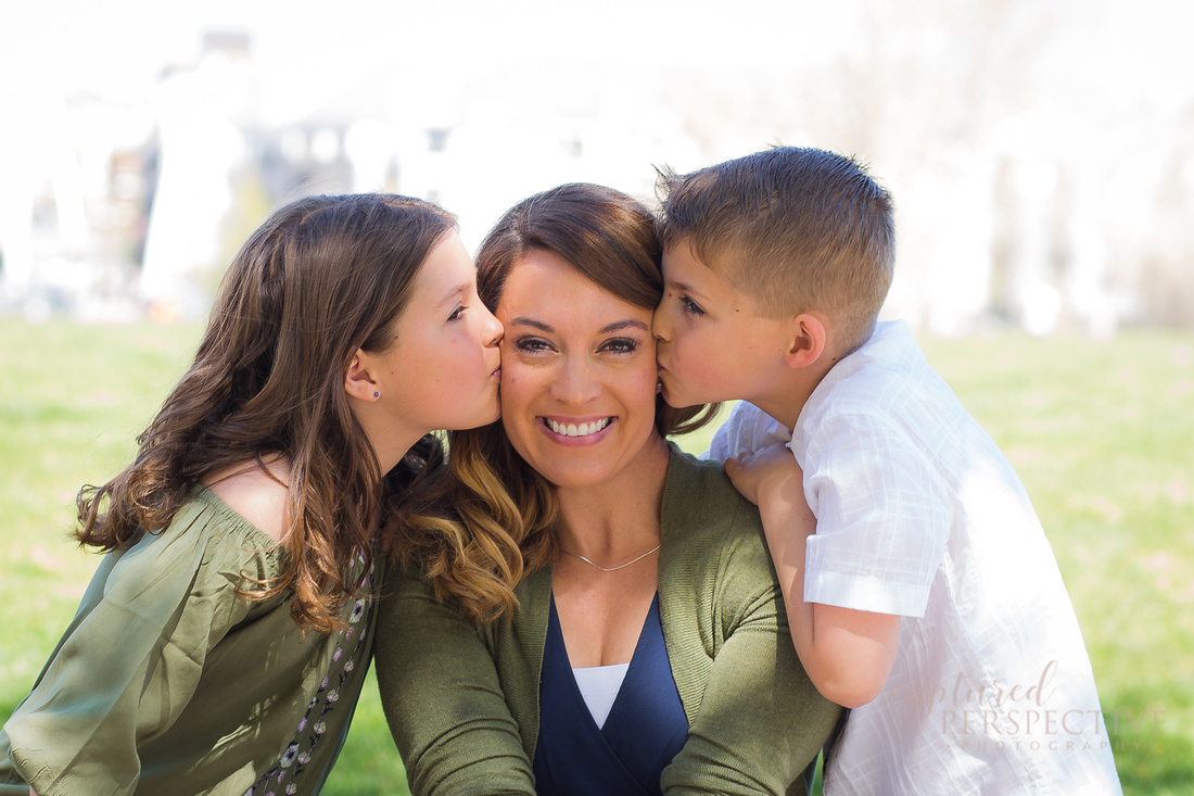 Family taking outdoor portraits in downtown Denver Colorado